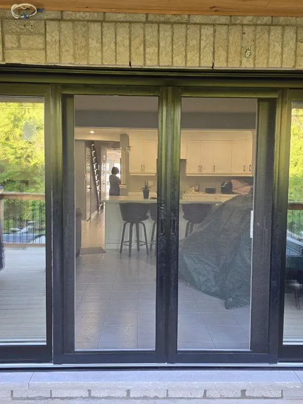 Black-framed patio door opening in an exterior wall