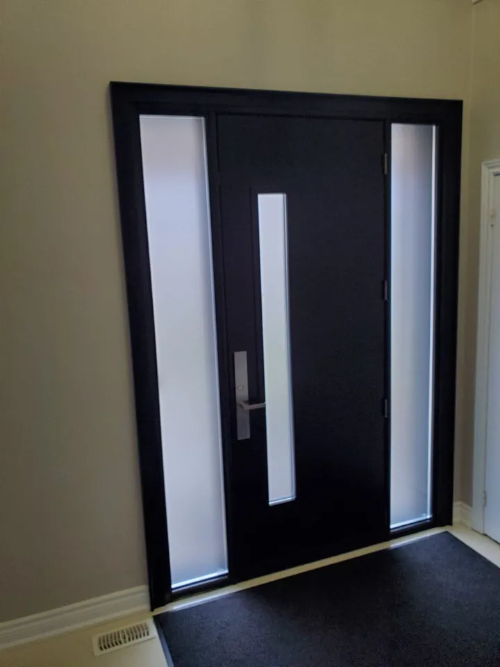 Black modern entry door with tall glass sidelites